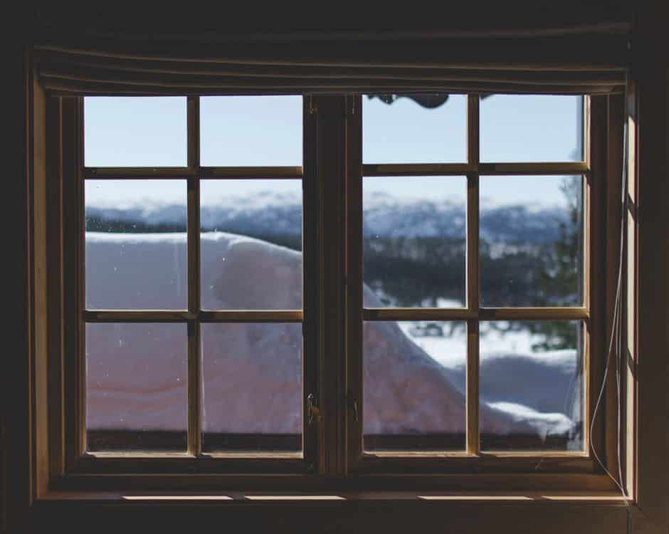 wooden glass window with a winter view