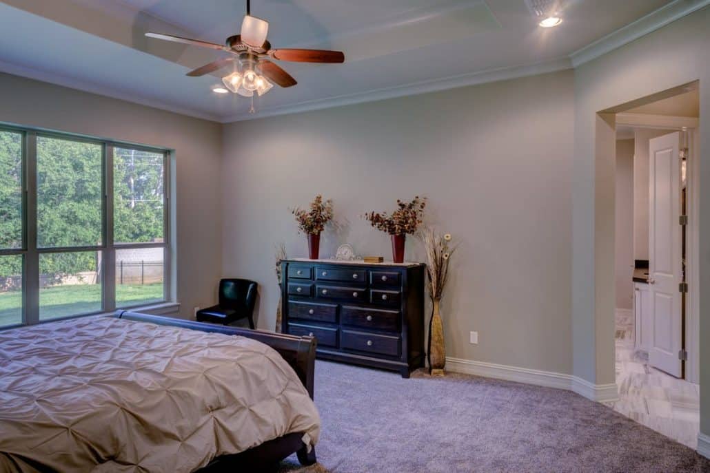 comfortable bedroom using ceiling fan during winter